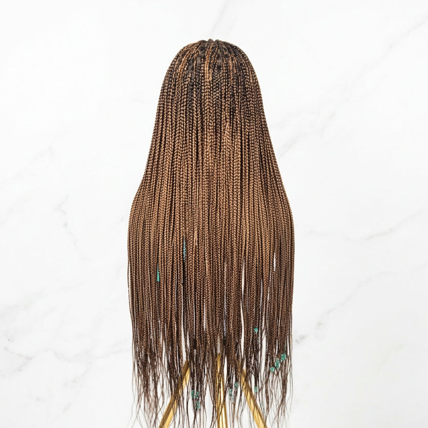 Braided wig on a gray background