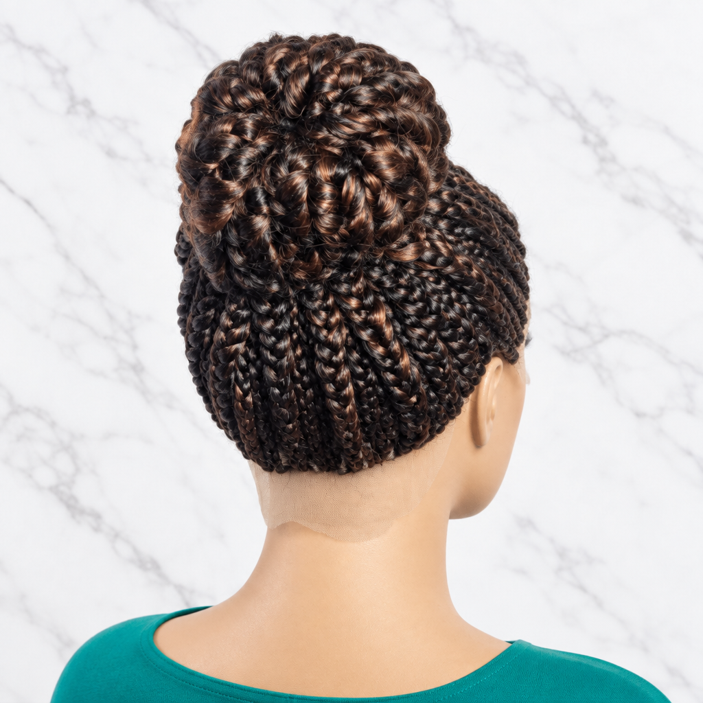 Back view of a textured braided bun wig. dark brown and black braids with subtle warm highlights