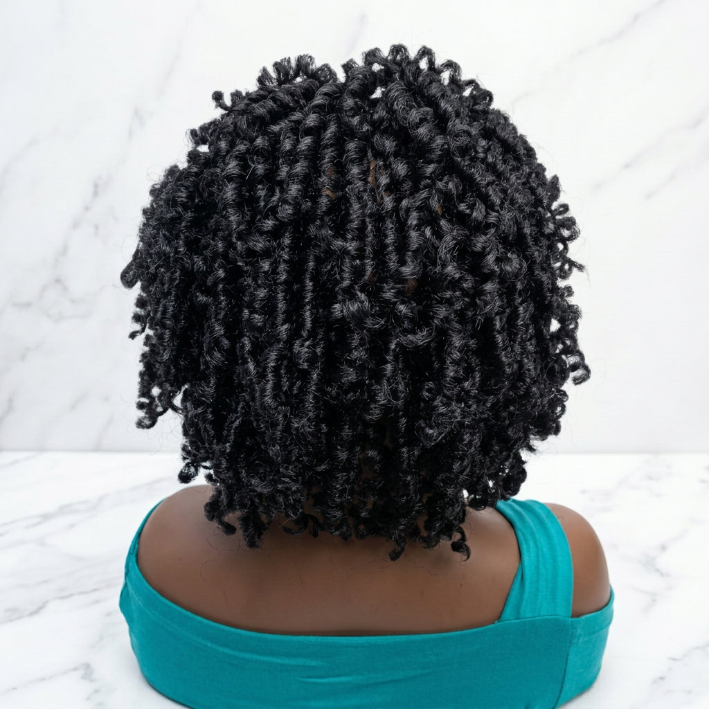 A short, curly wig. The wig has tight, defined curls in black color