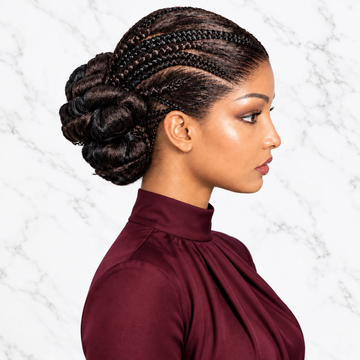 a dark brown braided updo hairstyle with a high bun